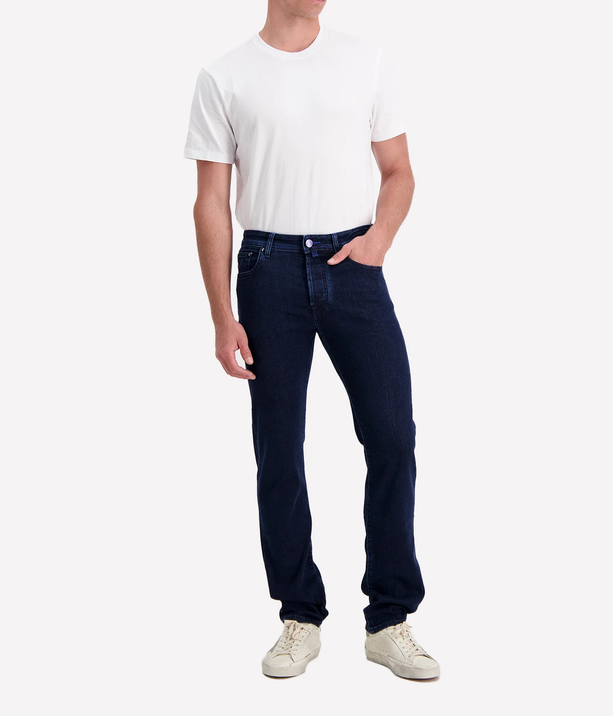 Men’s slim-fit jeans in dark blue-purple wash with five-pocket design, branded hardware, and suede patch.
