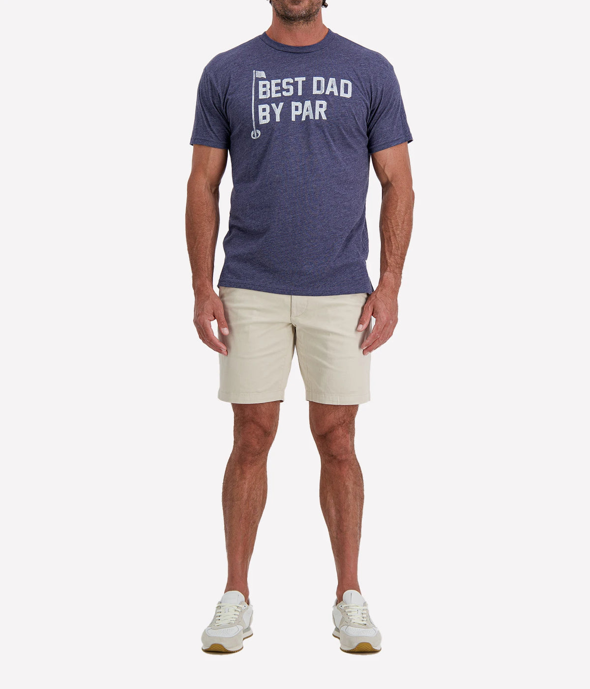 Man wearing Retro Brand Best Dad By Par Tee in Navy with stone shorts and white sneakers, full-length front view