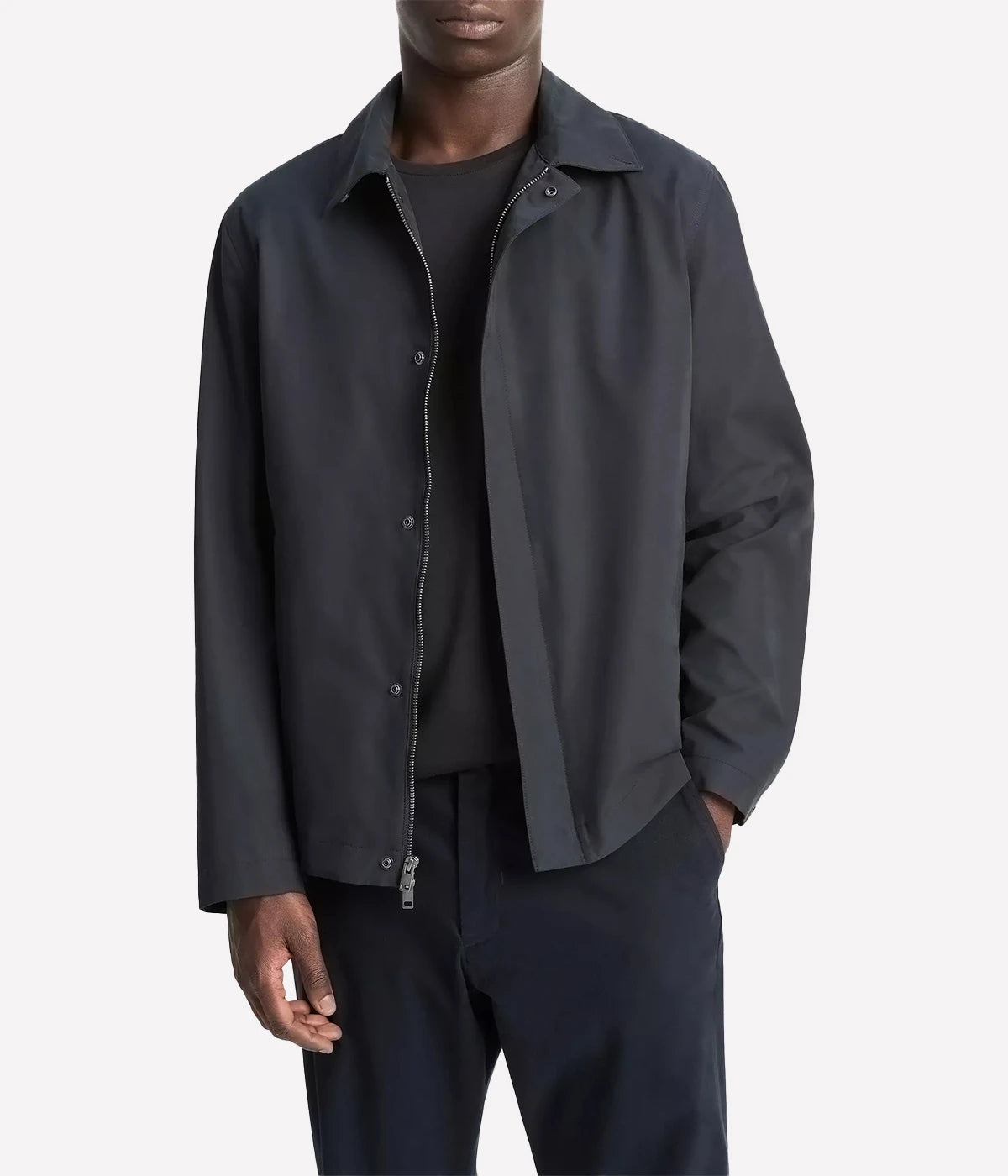 Vince men’s lightweight cotton-blend jacket in a soft peached finish with convertible collar, zip and snap front, and gusseted back for movement.