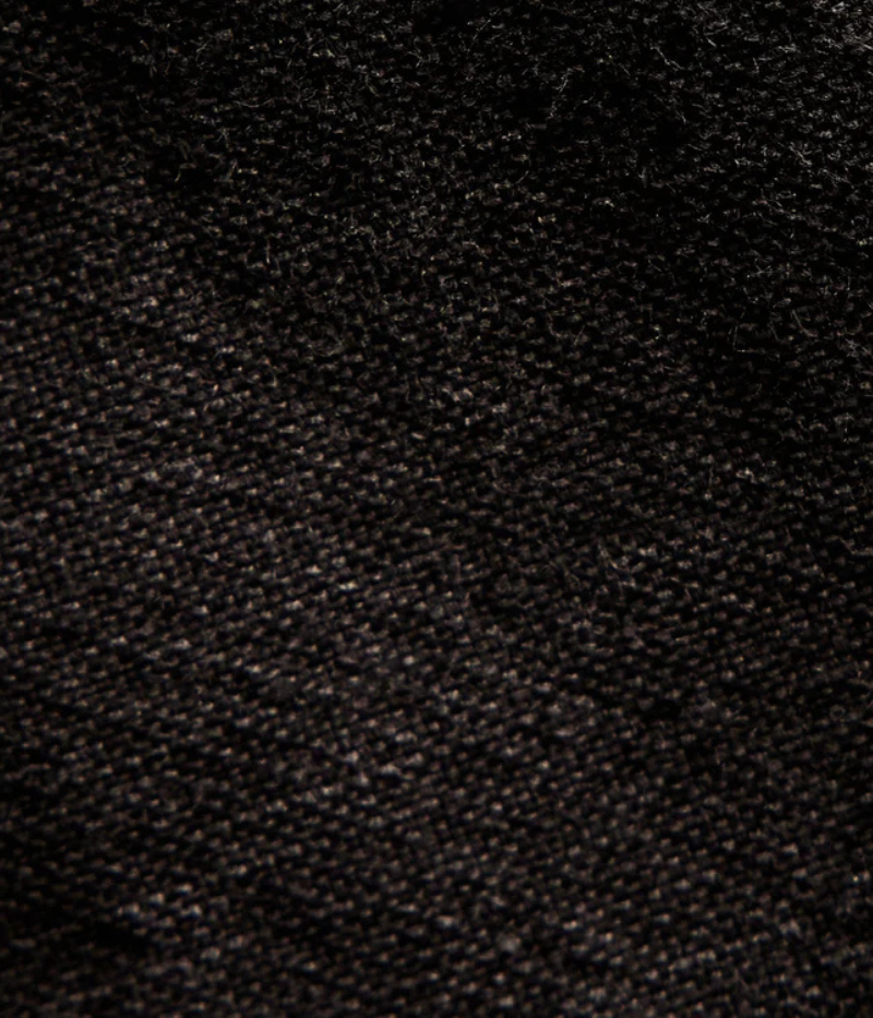 Textured cotton hemp flight pants in a relaxed fit, featuring a button fly, cuffed leg opening, knee tuck details, and snap button flap pockets. Crafted from breathable Italian cotton hemp with a unique textured finish.