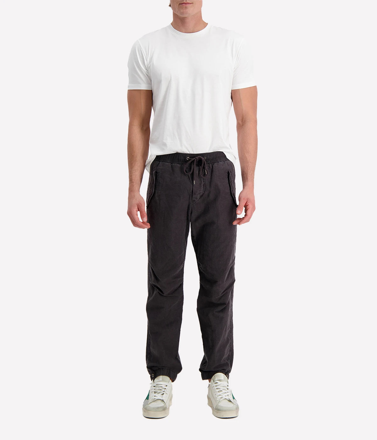 Textured cotton hemp flight pants in a relaxed fit, featuring a button fly, cuffed leg opening, knee tuck details, and snap button flap pockets. Crafted from breathable Italian cotton hemp with a unique textured finish.
