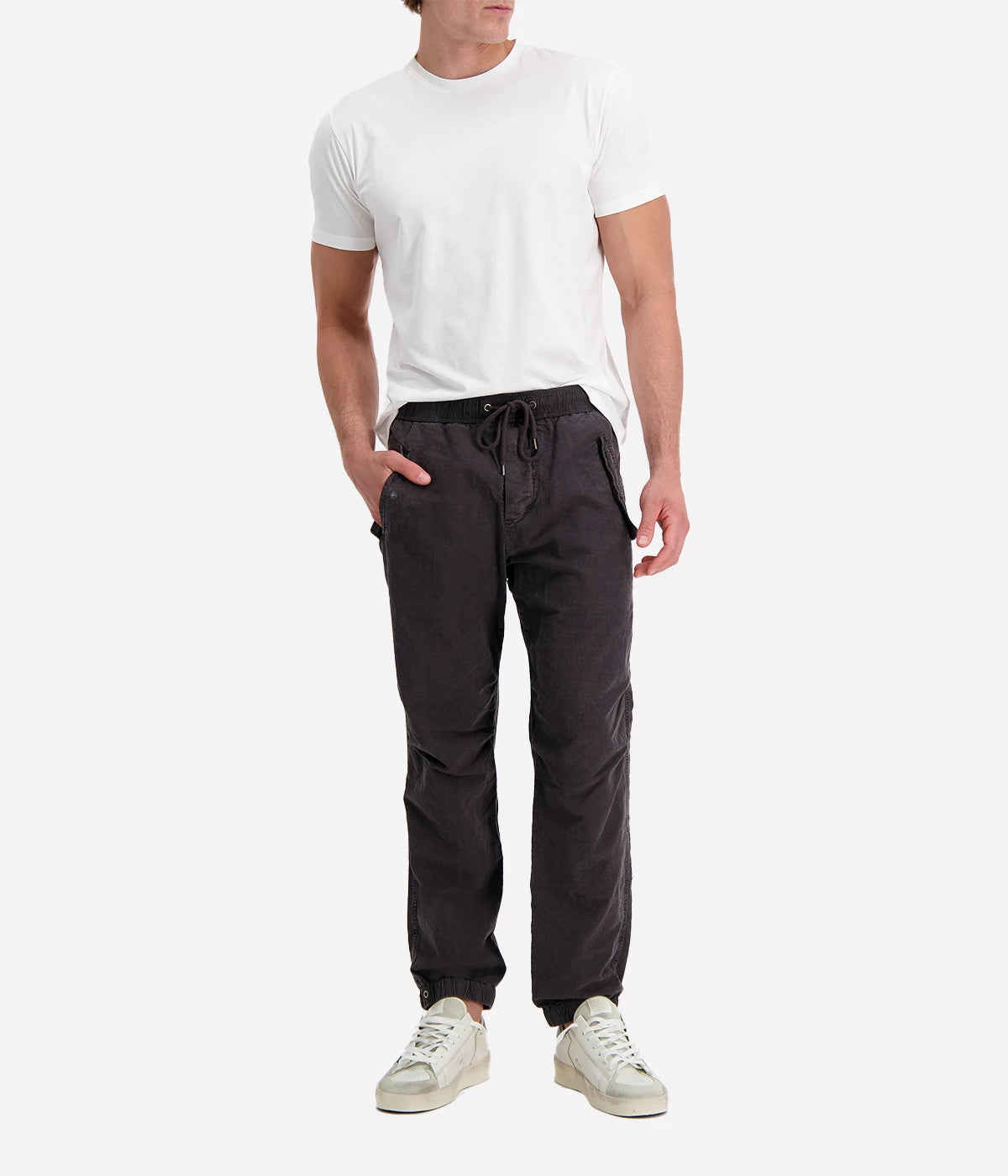 Textured cotton hemp flight pants in a relaxed fit, featuring a button fly, cuffed leg opening, knee tuck details, and snap button flap pockets. Crafted from breathable Italian cotton hemp with a unique textured finish.