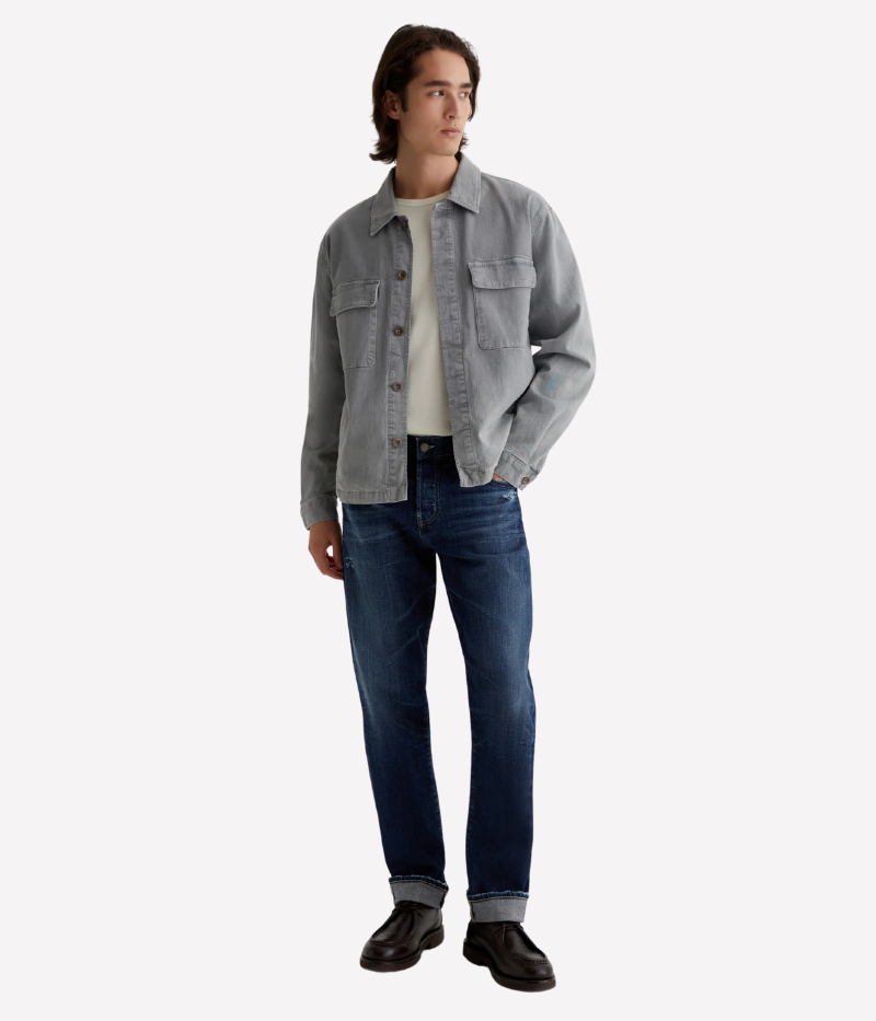 AG Everett slim straight Japanese selvage jeans in dark indigo wash with fading and whiskering, made from non-stretch denim.