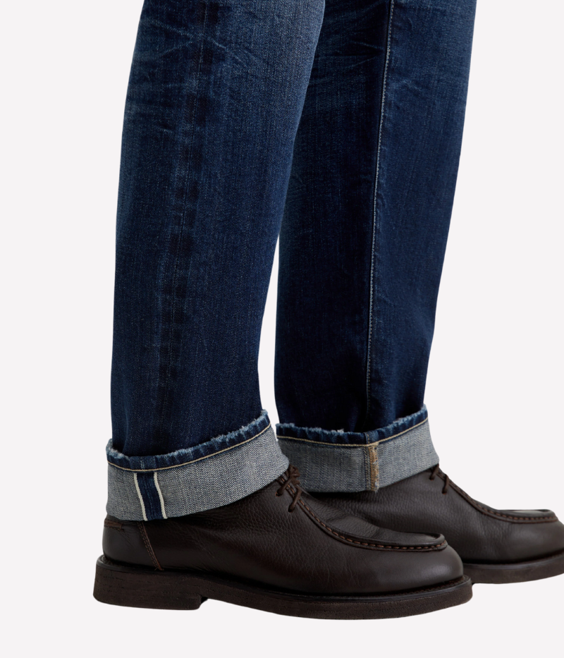 AG Everett slim straight Japanese selvage jeans in dark indigo wash with fading and whiskering, made from non-stretch denim.