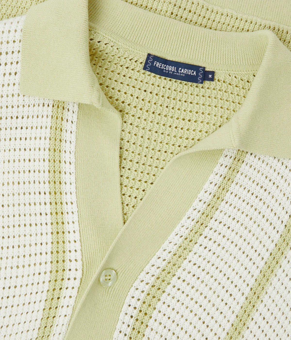Fabricio Cardigan in 100% cotton with a pointelle knit and striped design. Featuring a relaxed fit, open collar, button-up front with branded mother-of-pearl buttons, front patch pockets, and ribbed hem and cuffs.