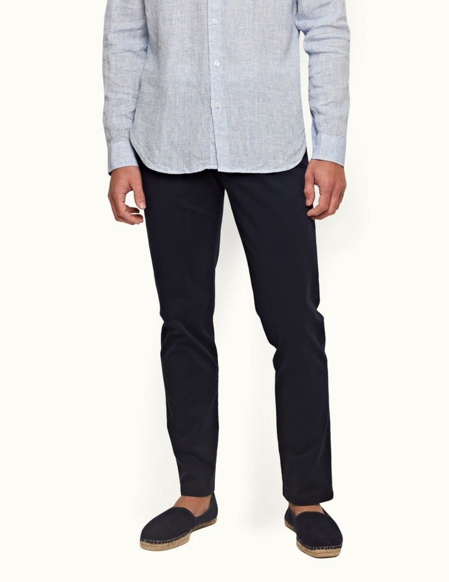 Fallon Dark Navy trousers with tailored fit, adjustable side fasteners, and multiple pockets. Made from stretch-cotton twill for comfort and versatility, perfect for both casual and dressy looks.