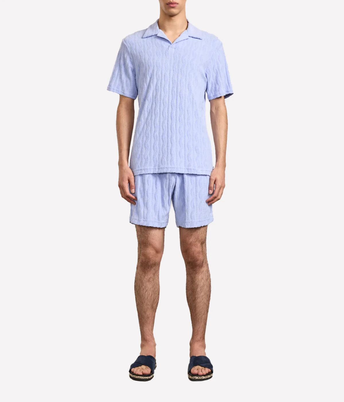 Faustino polo in organic Terry cotton with jacquard pattern, open camp collar, relaxed fit, and side slits. Buttonless collar for a modern twist.