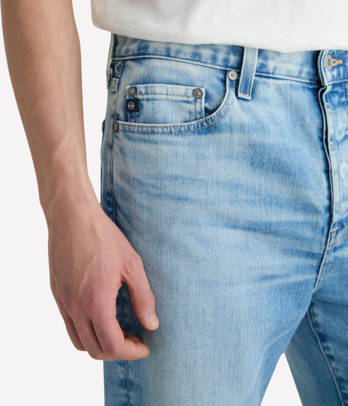 AG Felix Jean in Lobera light wash, featuring a vintage straight leg, button fly, and eco-friendly Vapor Wash™ finish on Japanese stretch denim.