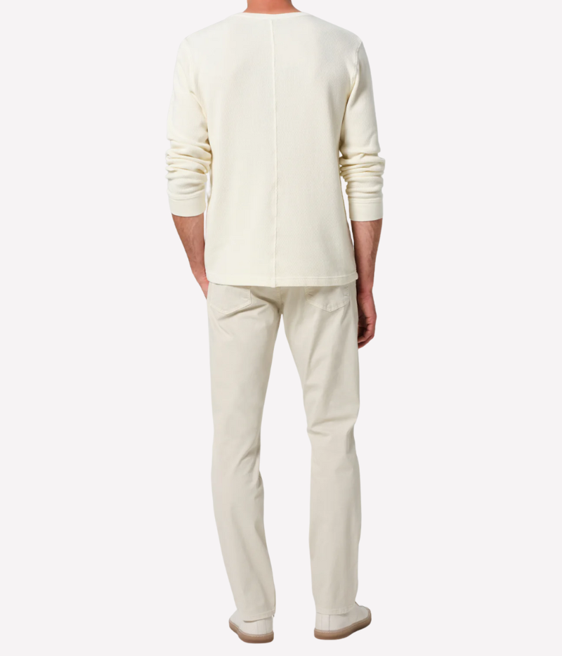 Slim straight cream jeans with a relaxed fit through the thigh and tapered ankle, crafted from midweight denim with a touch of stretch for comfort.