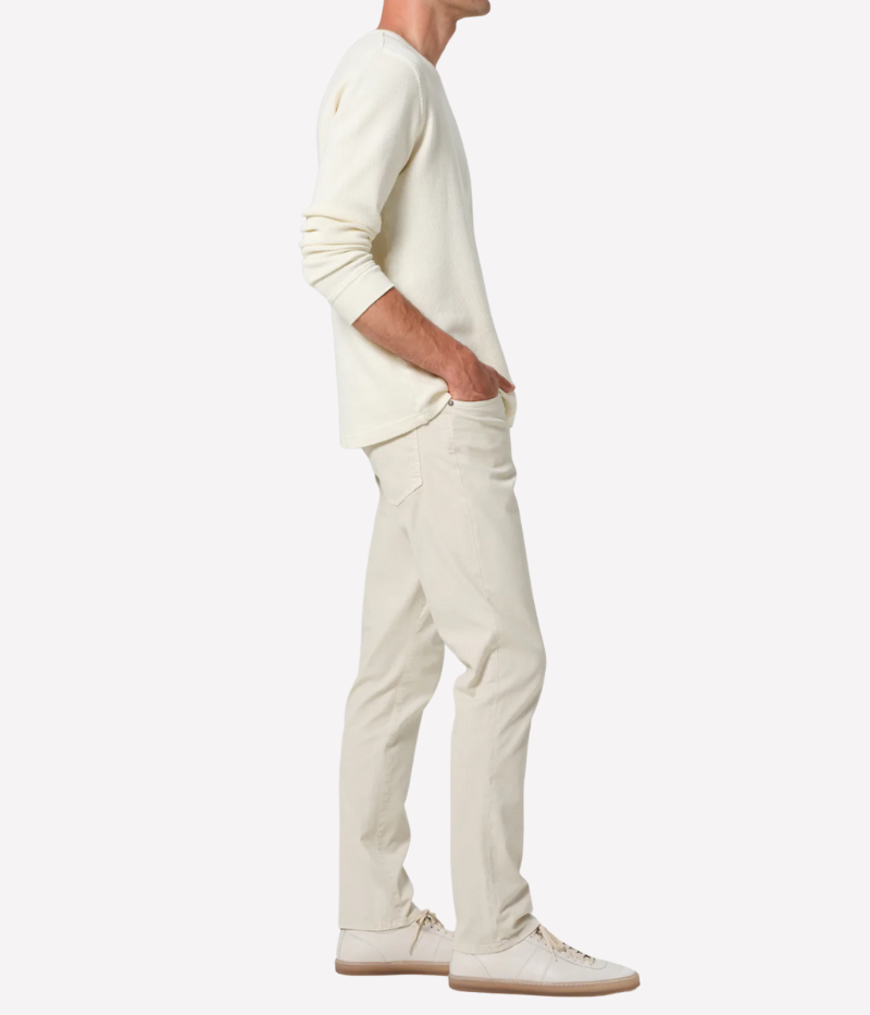 Slim straight cream jeans with a relaxed fit through the thigh and tapered ankle, crafted from midweight denim with a touch of stretch for comfort.