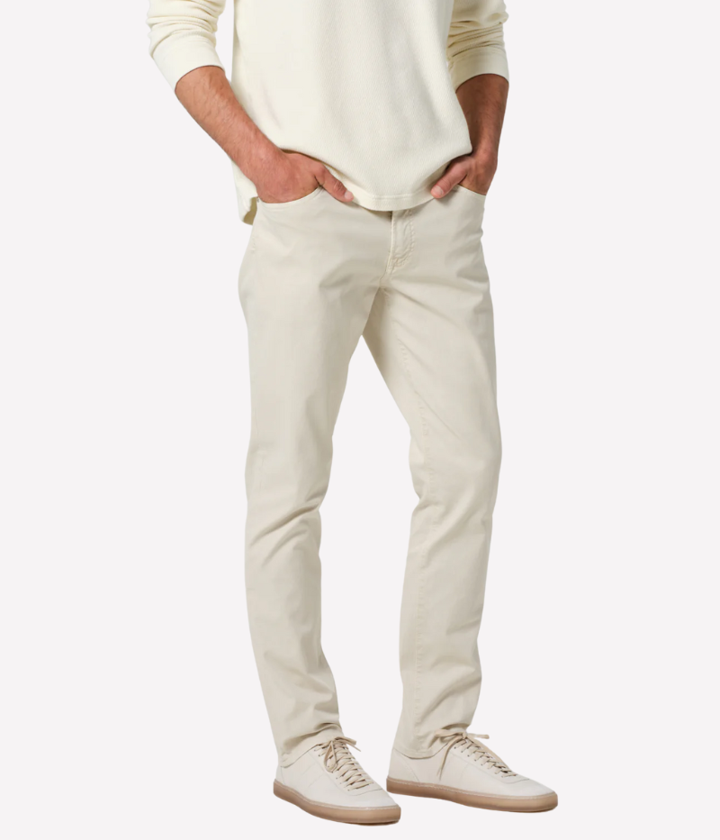 Slim straight cream jeans with a relaxed fit through the thigh and tapered ankle, crafted from midweight denim with a touch of stretch for comfort.