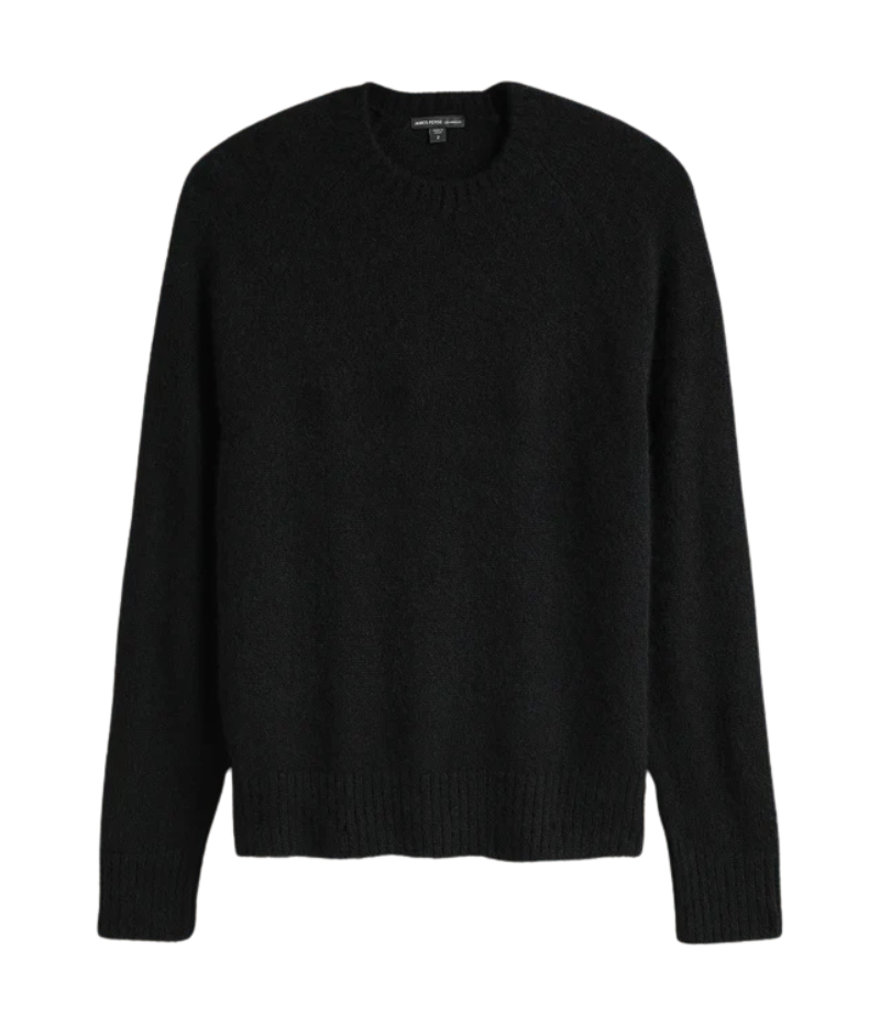 A lightweight, true black cashmere crewneck sweater featuring ribbed detailing at the neckline, cuffs, and hem for a classic and polished appearance.
