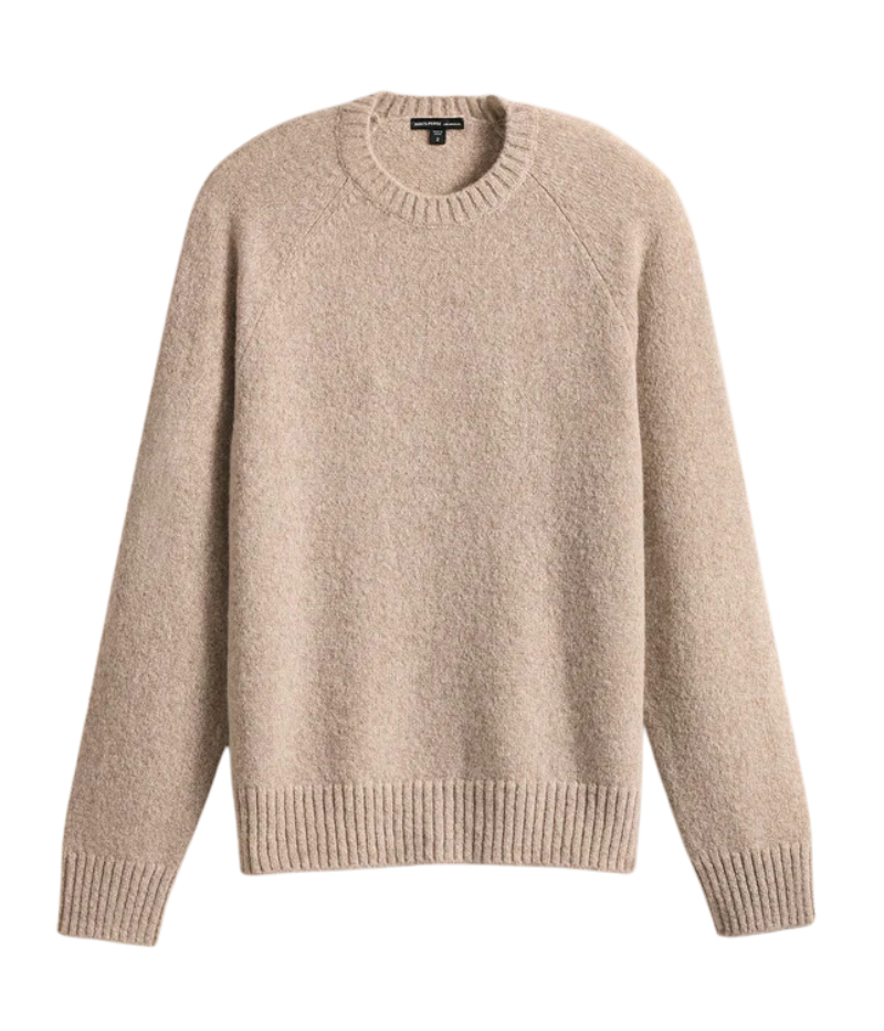 A soft, lightweight cashmere crewneck sweater in hazel brown, featuring ribbed detailing at the neckline, cuffs, and hem for a timeless and polished design.