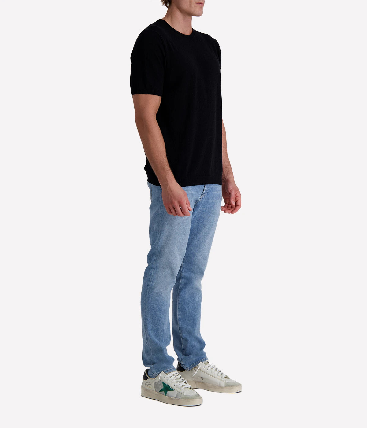 Black spongy-knit t-shirt crafted from a textured cotton blend, finished with ribbed details for a sleek and modern twist.