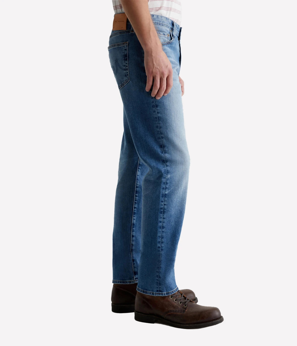The Graduate men's straight jean, featuring a slim mid-rise waist with a relaxed fit from hip to knee, tapering at the leg opening. Detailed measurements include a 10" front rise, 17" knee opening, 15.5" bottom opening, and 32" inseam.