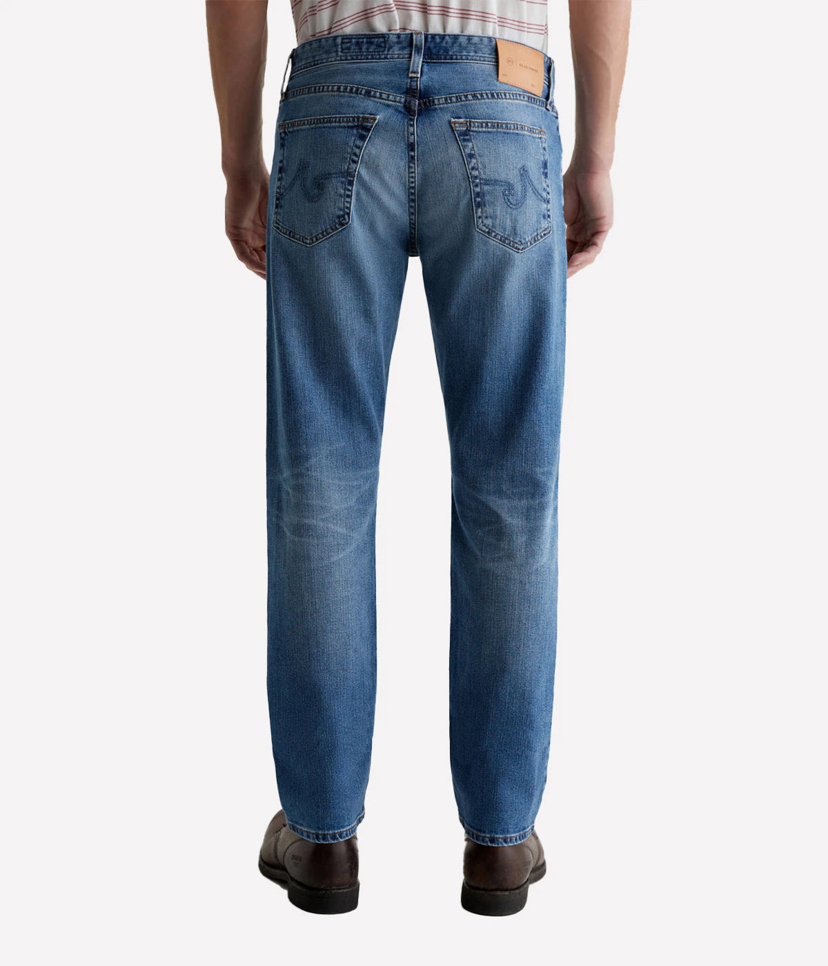 The Graduate men's straight jean, featuring a slim mid-rise waist with a relaxed fit from hip to knee, tapering at the leg opening. Detailed measurements include a 10" front rise, 17" knee opening, 15.5" bottom opening, and 32" inseam.