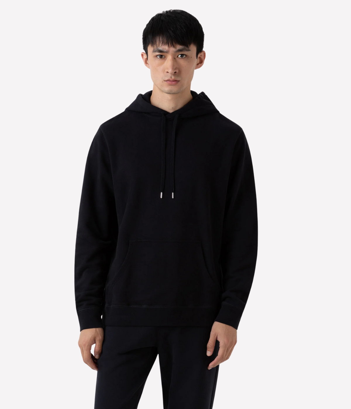 Men’s black loopback hoodie with double-layered hood, ribbed trims, and patch pocket—crafted from breathable cotton for year-round comfort.
