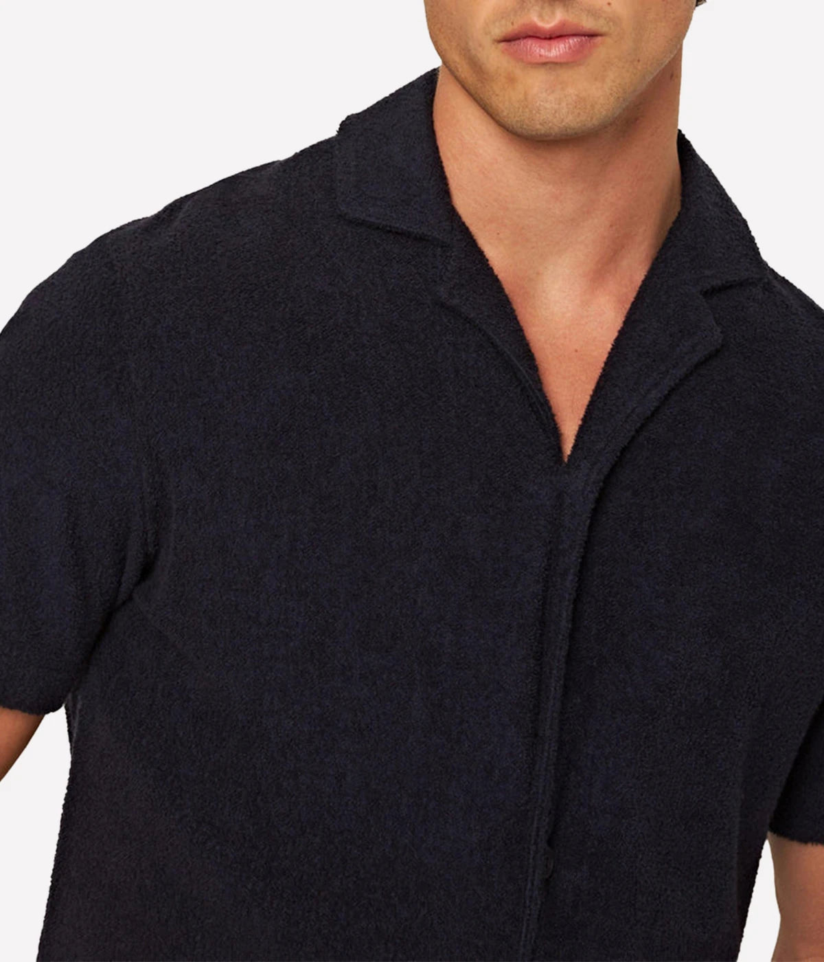 Night Iris Howell shirt from Orlebar Brown, crafted from double-faced towelling pique. Features a relaxed fit, Capri collar, 3-button opening, and branded nylon buttons. A versatile and stylish shirt perfect for summer and travel.