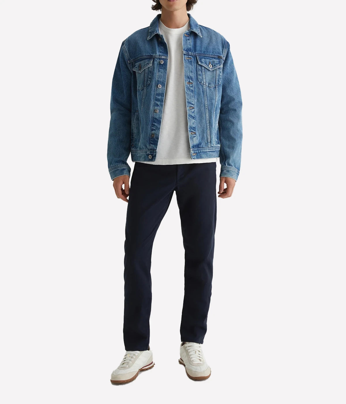 Styled with a t-shirt and denim jacket, the Jamison Skinny Trouser in navy creates a polished yet relaxed outfit. Featuring a slim, tailored fit and tapered legs, this trouser made from Sorrento Stretch Twill adds a sophisticated touch to any wardrobe, offering both comfort and style for everyday wear.
