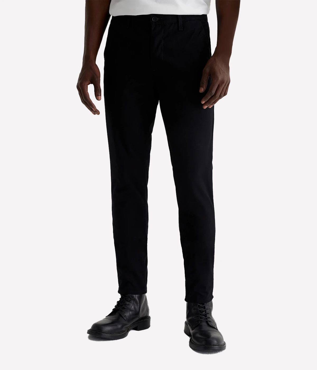 A full front view of the Jamison Skinny Trouser in black, cut from 7.8 oz. Sueded Brushed Moleskin. The slim upper block and tapered leg openings create a tailored, sleek silhouette. The trousers feature welt pockets at the back, offering a refined look for both work and casual settings.