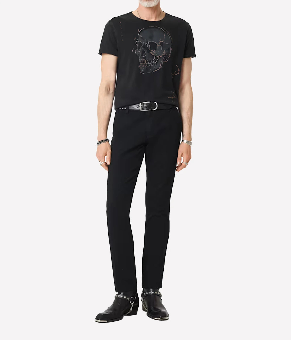 Man wearing John Varvatos Skull Embroidery Raw Edge Tee in Black with black trousers, full-length front view