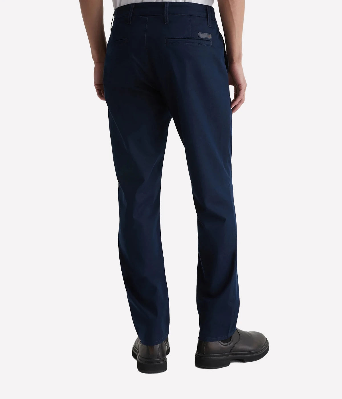 Men’s dark blue performance trousers with slim fit, on-seam front pockets, and welt back pockets.
