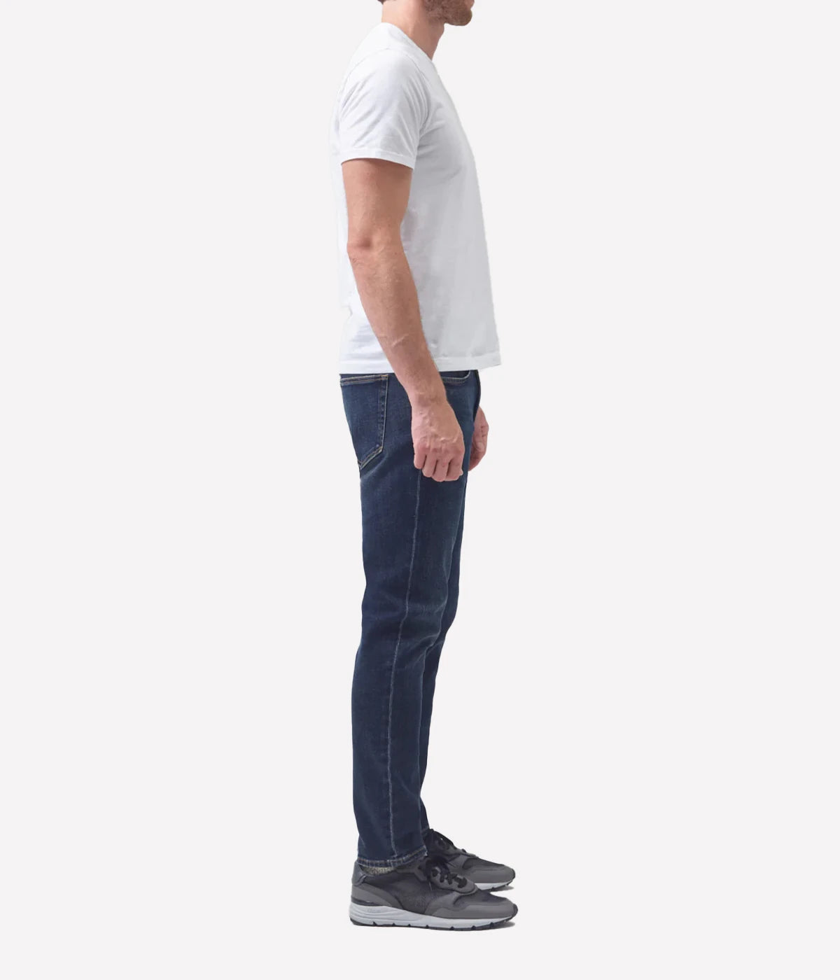 Side profile of the London Slim Taper jeans, showcasing the streamlined fit and durable Perform denim fabric.