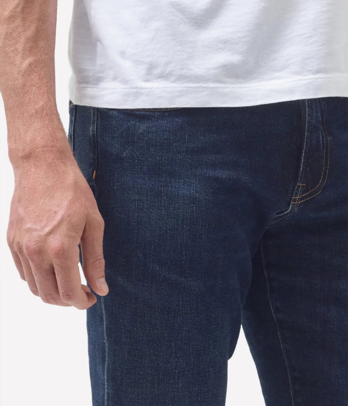 Close-up of the Perform denim texture, tonal stitching, and waistband, emphasising the premium craftsmanship.