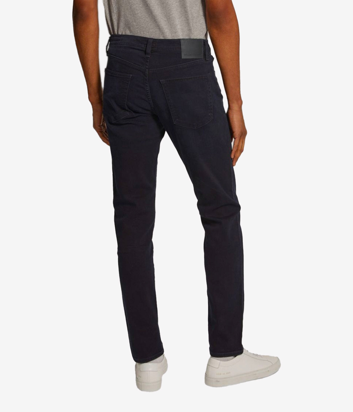 Slim-fit tapered jeans in dark wash, crafted with durable Perform denim fabric.