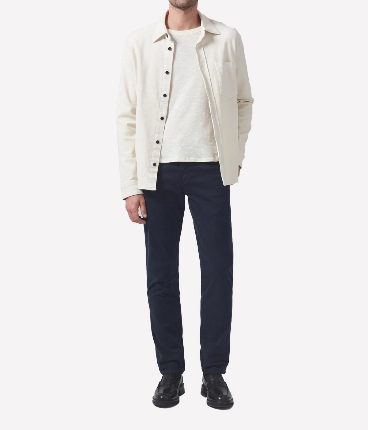 The London Slim Taper jeans paired with a white tee and loafers for a casual yet refined outfit.