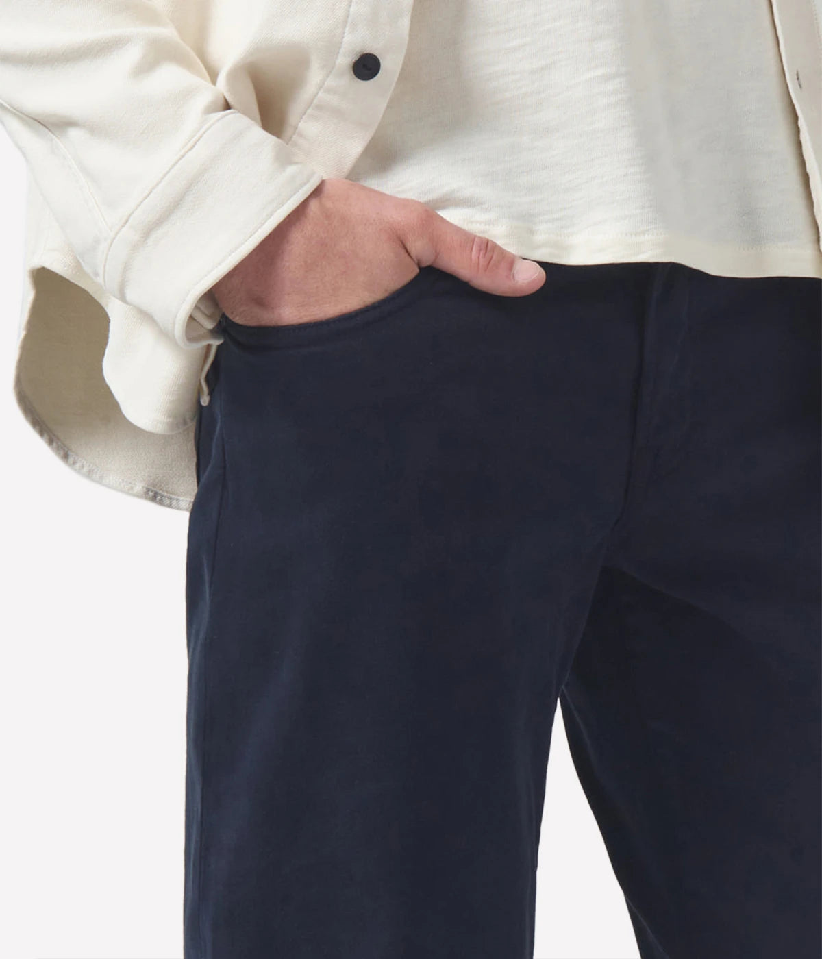 Close-up of the Perform denim texture, tonal stitching, and waistband, emphasising the premium craftsmanship.