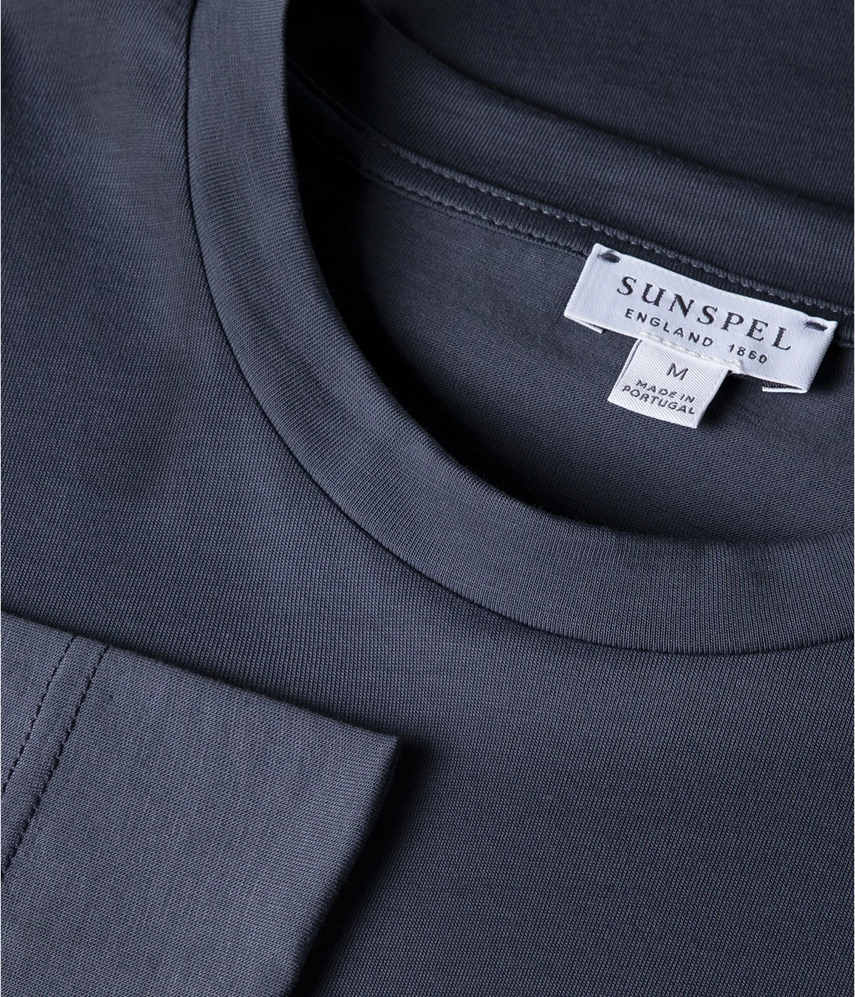 Men’s Slate Blue Long Sleeve Riviera T-Shirt – Luxurious midweight cotton T-shirt in slate blue, inspired by the iconic style worn by James Bond in Casino Royale, perfect for layering or wearing solo in winter.