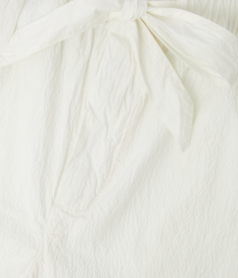 Men’s ivory wide-leg seersucker trousers by Frescobol Carioca, featuring an elasticated waistband with drawstring and lightweight cotton texture perfect for warm weather.