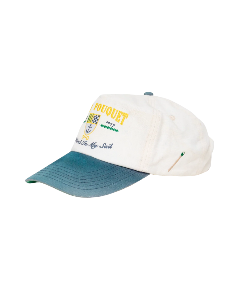Nick Fouquet anchor crest cap – natural/blue potassium-sprayed canvas with embroidered anchor on front and "Oceania Kalypso" on strap.