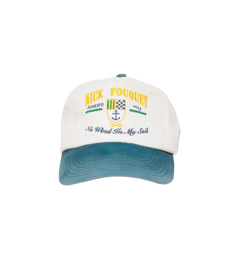 Nick Fouquet anchor crest cap – natural/blue potassium-sprayed canvas with embroidered anchor on front and "Oceania Kalypso" on strap.