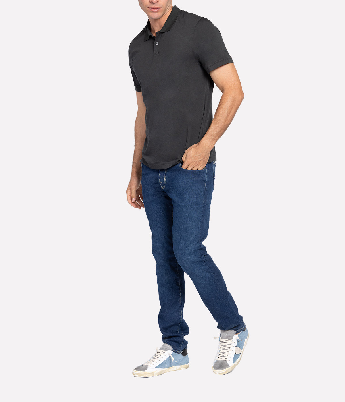 An on model shot showing the relaxed fit of the Luxe Lotus Jersey Polo. Polished carbon top made of lightweight, comfortable fabric. A James Perse staple you must have in your closet.