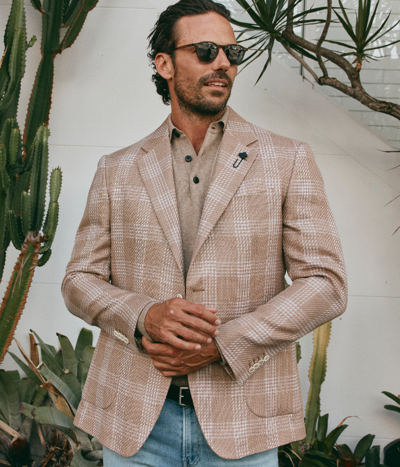 Beige and cream checked Lardini blazer made from a cotton and linen blend, featuring a single-breasted design, signature lapel flower, and a lightweight, half-lined interior.
