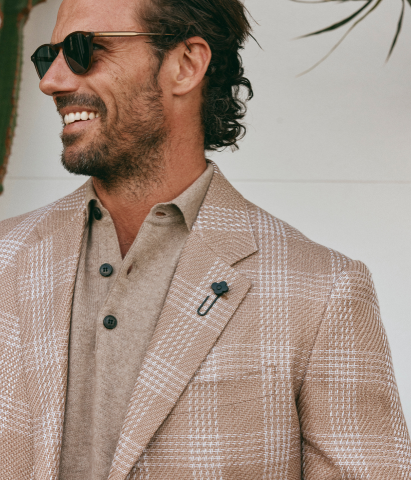 Beige and cream checked Lardini blazer made from a cotton and linen blend, featuring a single-breasted design, signature lapel flower, and a lightweight, half-lined interior.