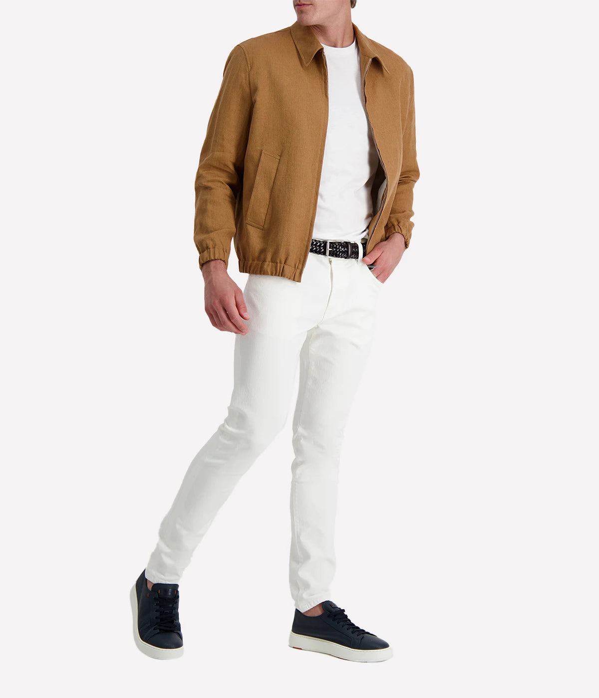 Man wearing a tan Lardini linen jacket with a zip front, elasticated hem and cuffs, and a shirt collar, styled with a white tee and white trousers.