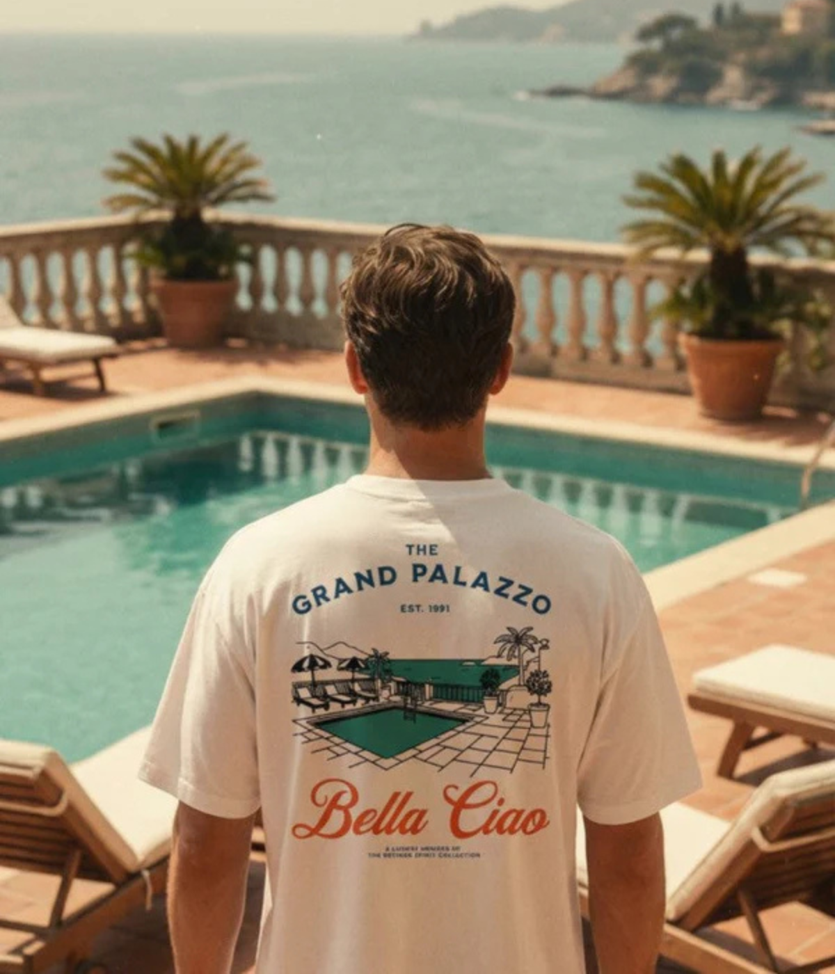 Back view of model wearing The Refined Spirit Grand Palazzo Tee in White