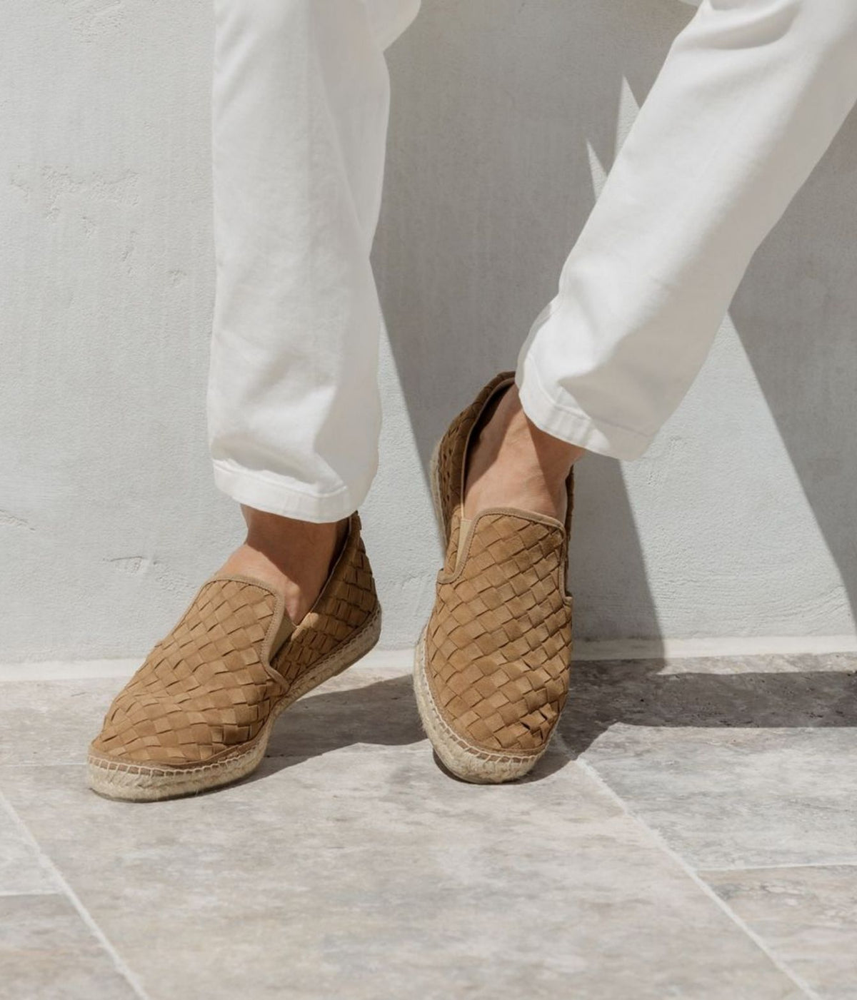 Man wearing Castañer Java Espadrilles in Arena with cream trousers, side view