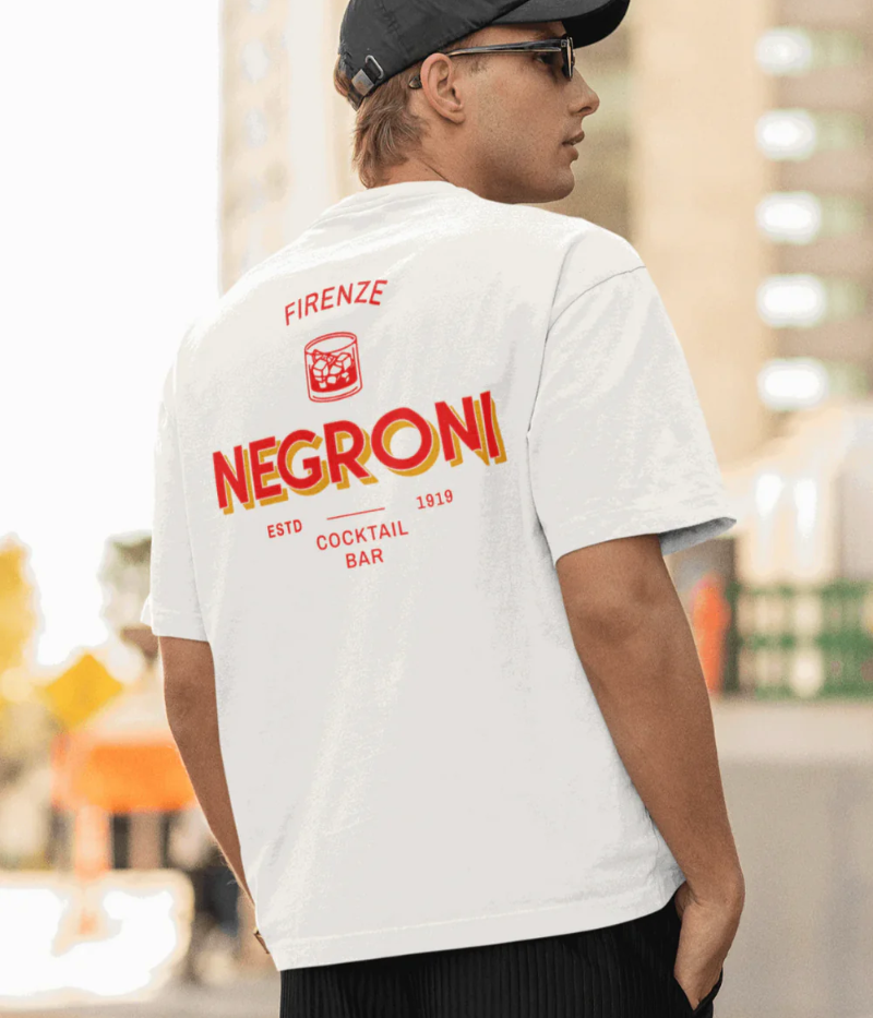 White t-shirt with red and yellow graphic: “Firenze Negroni Cocktail Bar ESTD 1919”