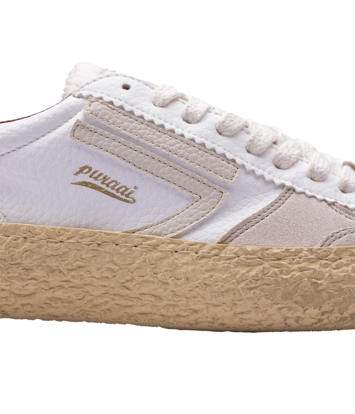 A close-up side view of a Puraai low-top sneaker featuring white and beige panels, white laces, and a textured beige jute-wrapped sole, set against a plain white background.