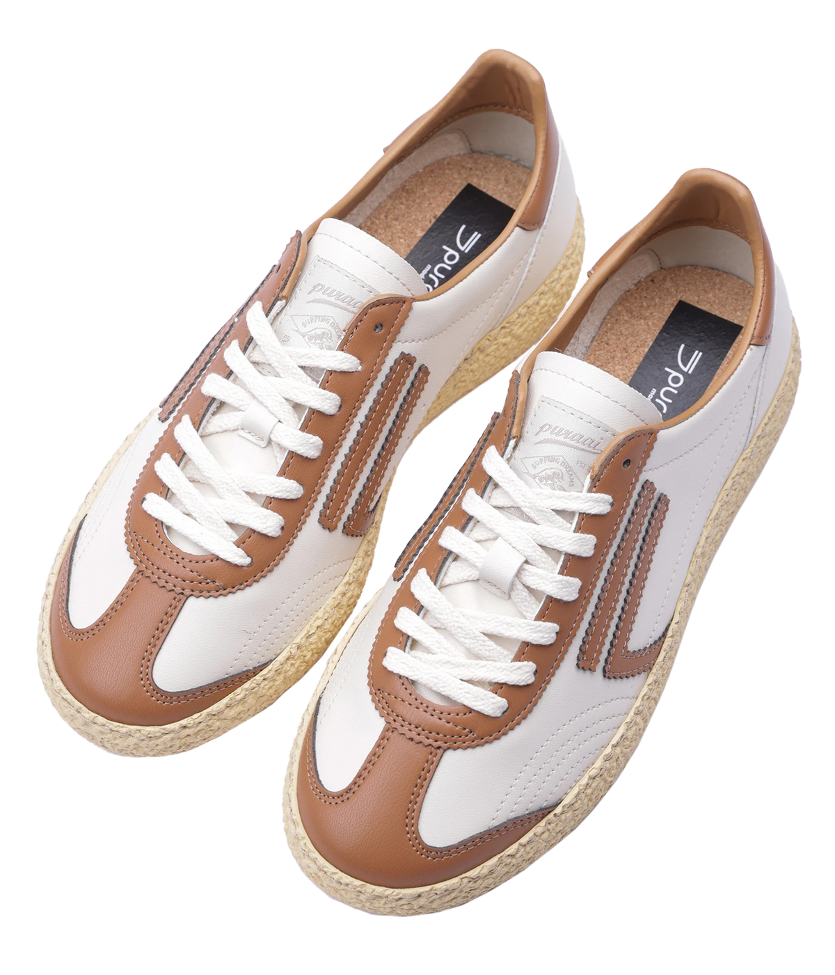 A pair of low-top sneakers with white panels, tan overlays, white laces, and natural jute-wrapped soles, shown on a plain white background.