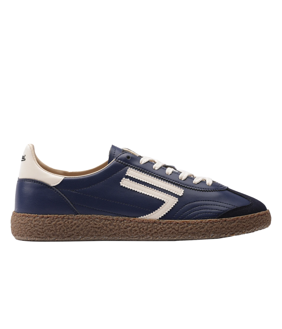 A navy blue sneaker with a textured brown sole, featuring a white side stripe design, white laces, and a cream heel tab.