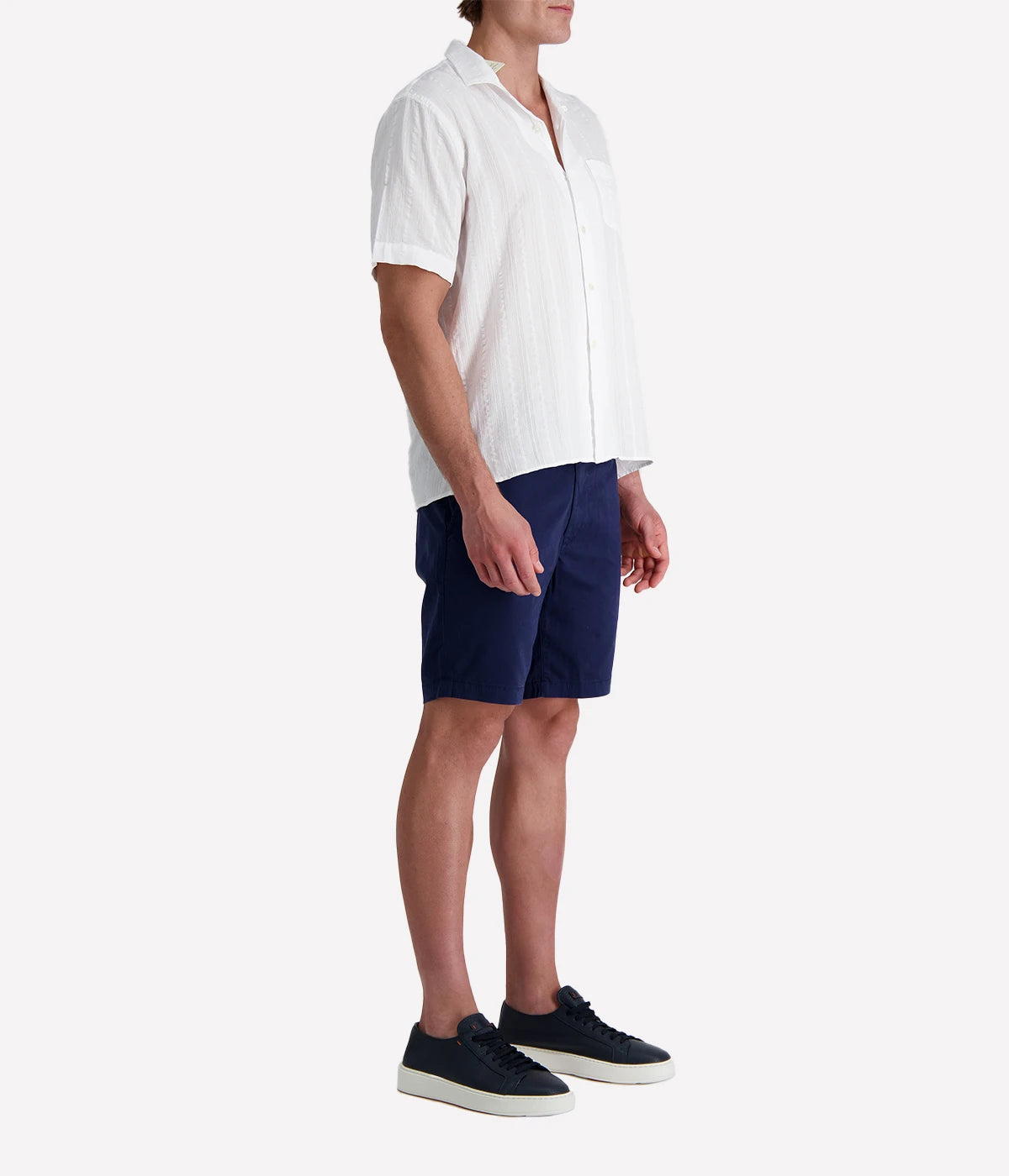 Men’s short-sleeve textured white cotton shirt with camp collar and chest pocket, designed in a regular fit for breathable, casual summer style.