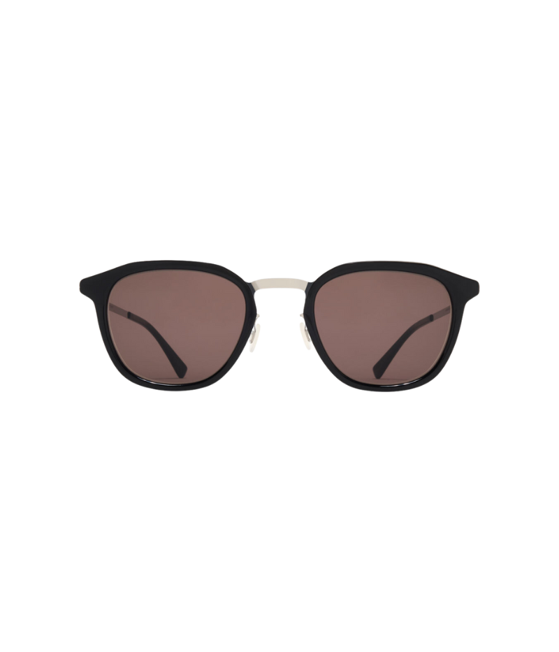 Close-up of the Pavi sunglasses, showcasing their sleek stainless steel frame and tinted lenses with anti-reflective coating for a modern, minimalist look.