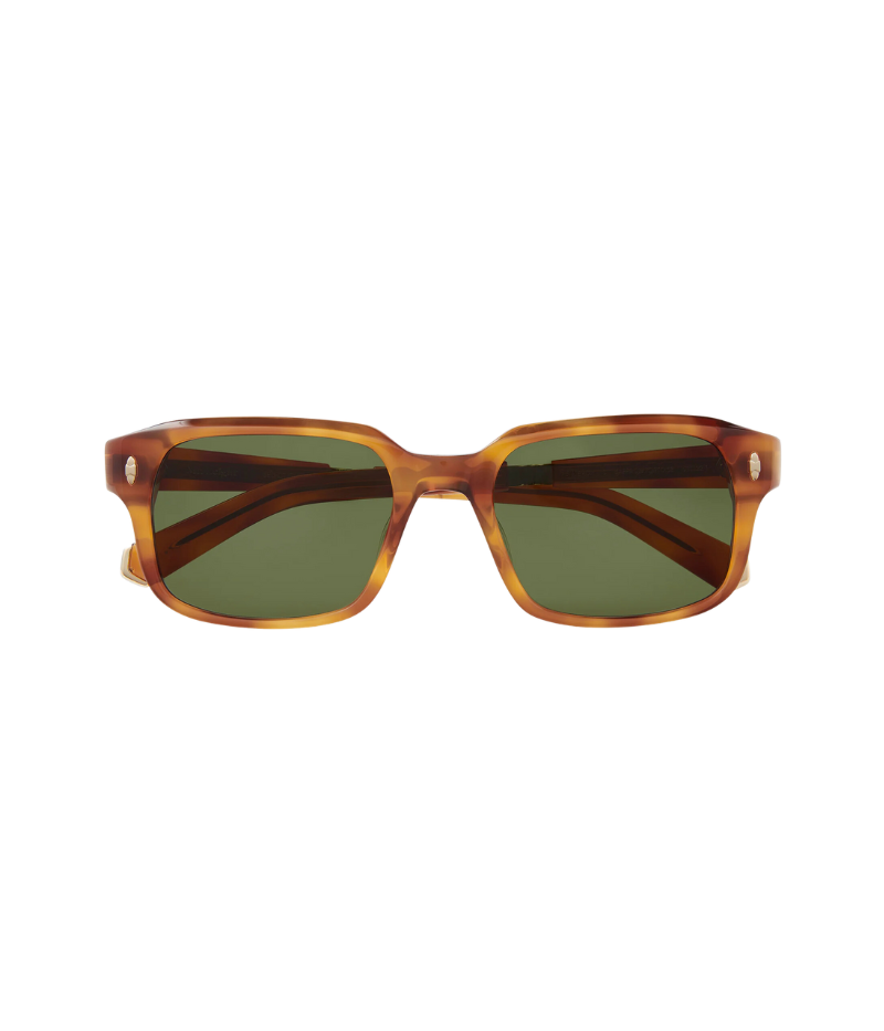 Close-up of Purveyor S sunglasses, featuring a bold, wide rectangular frame with sculpted, beveled design and custom titanium detailing.