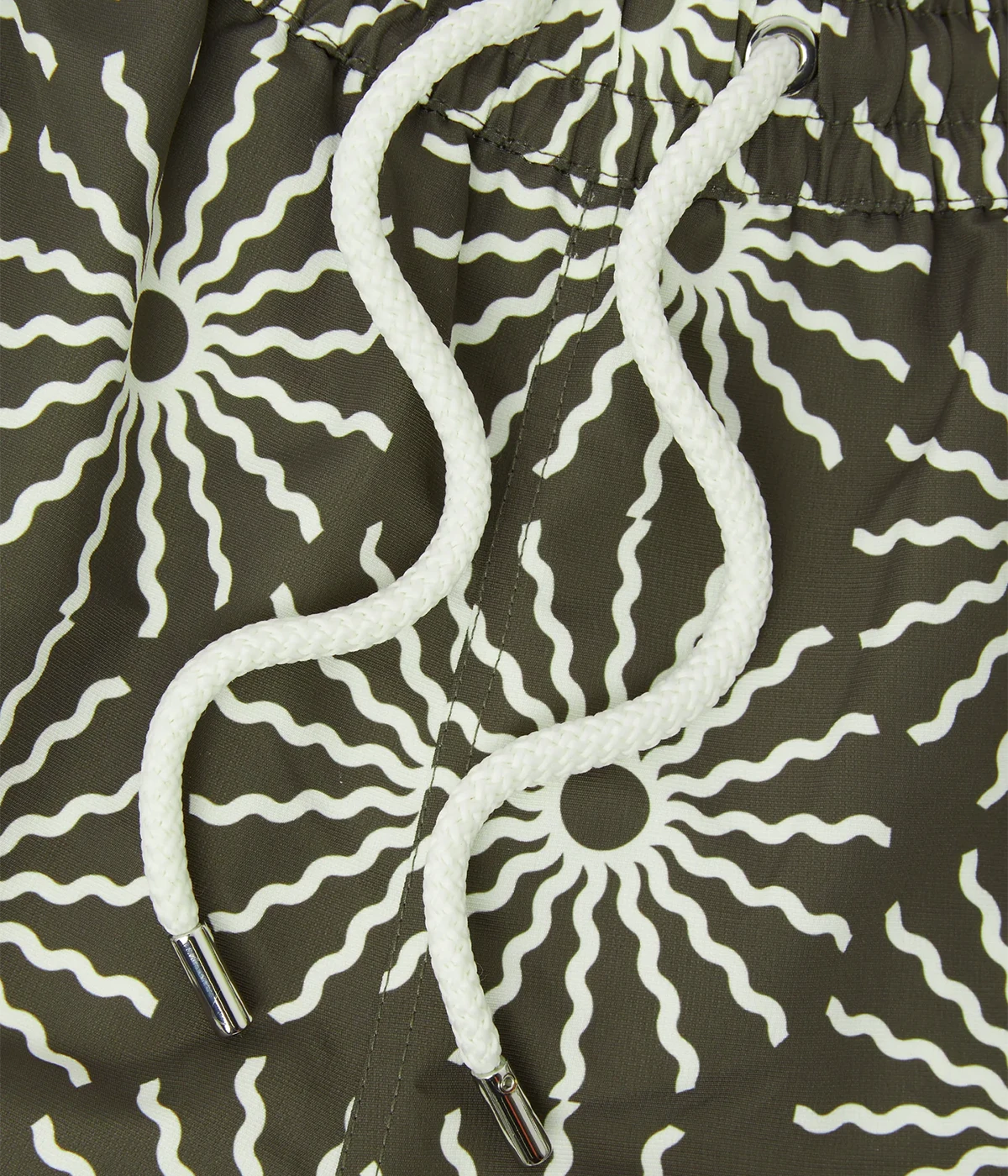 Rio Swim Shorts with sport fit, drawstring waist, branded cord-ends, 100% recycled polyester mesh lining, and back pocket with button-closure. Featuring bespoke O Sol motif.