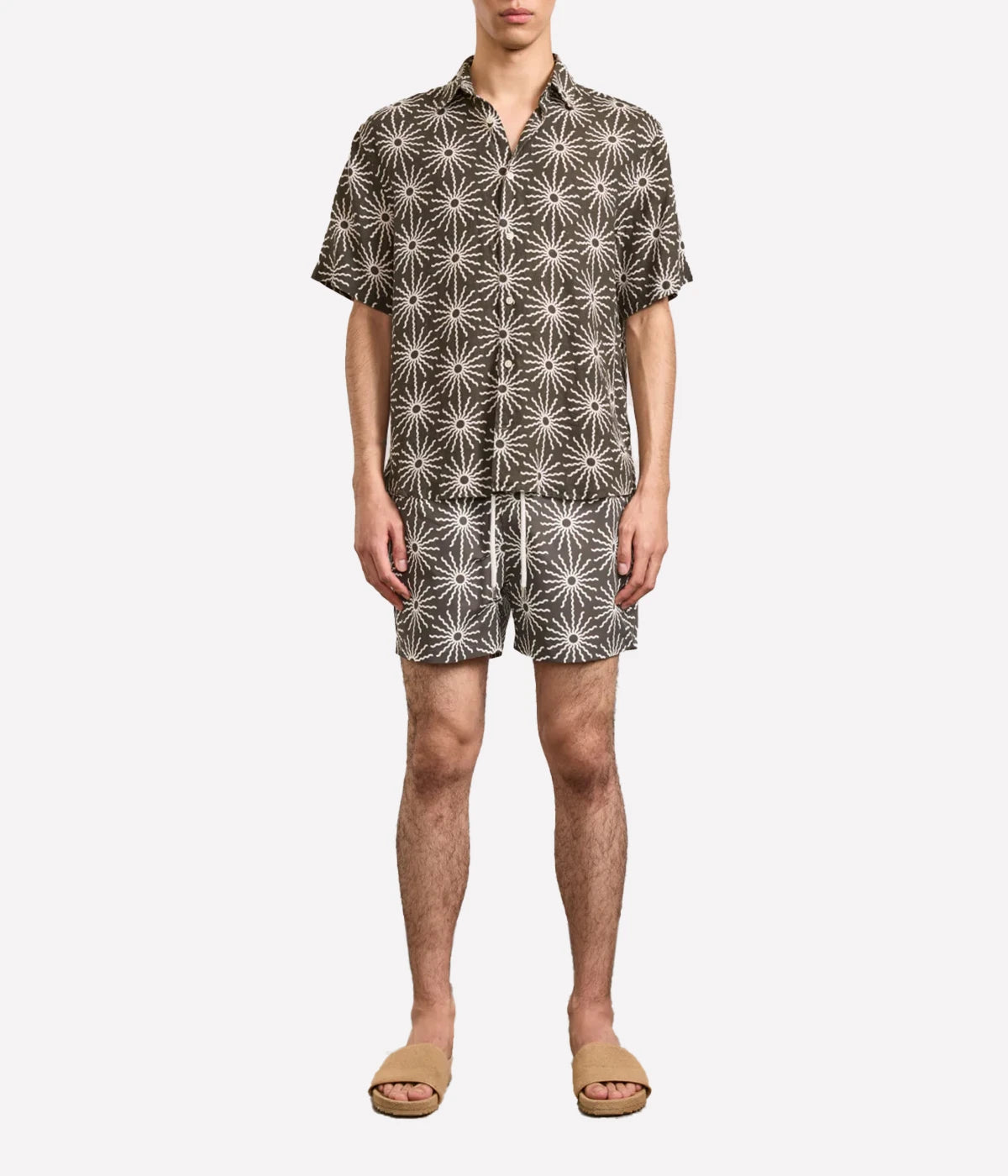 Rio Swim Shorts with sport fit, drawstring waist, branded cord-ends, 100% recycled polyester mesh lining, and back pocket with button-closure. Featuring bespoke O Sol motif.